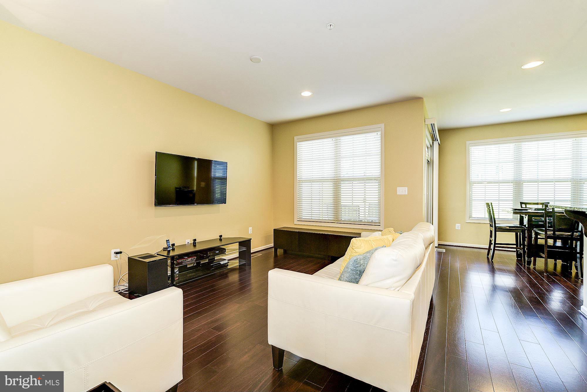 1525 Rabbit Hollow Place Silver Spring, MD 20906 - Photo 7 of 30 a living room with furniture and a flat screen tv