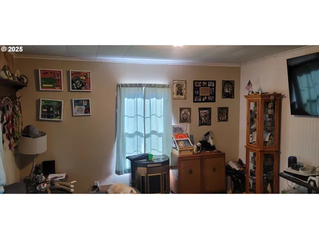 a living room with furniture and window