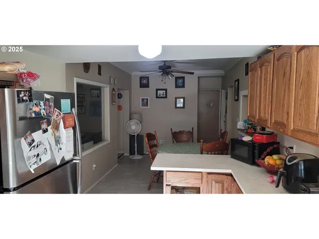 a living room with furniture a flat screen tv and a table