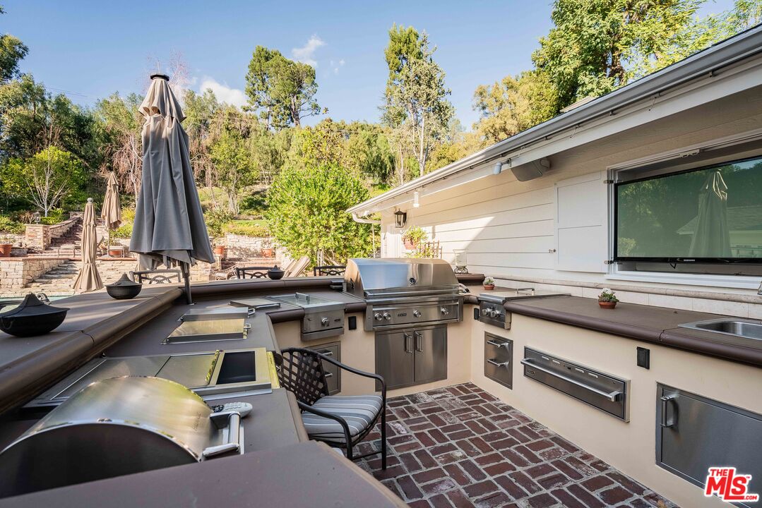 23939 Long Valley Road Hidden Hills, CA 91302 - Photo 13 of 61 a view of a backyard with chairs
