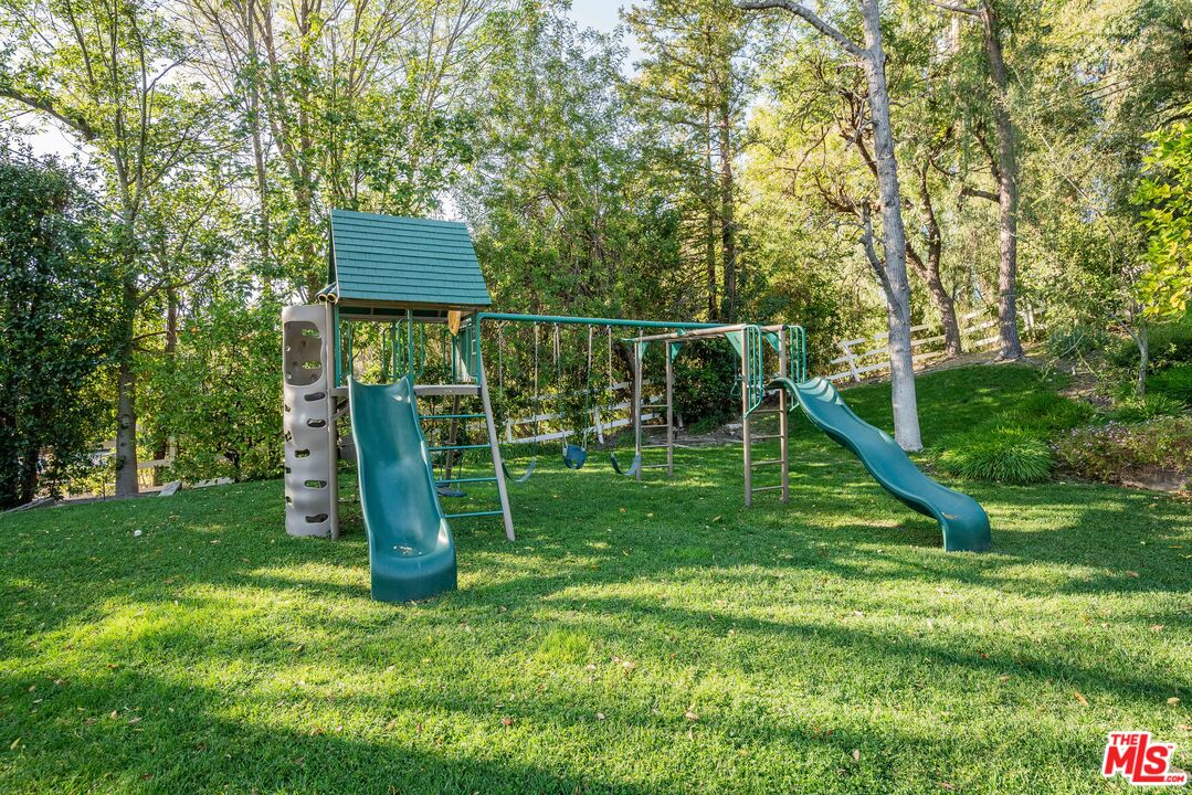 23939 Long Valley Road Hidden Hills, CA 91302 - Photo 15 of 61 a view of a garden with a slide
