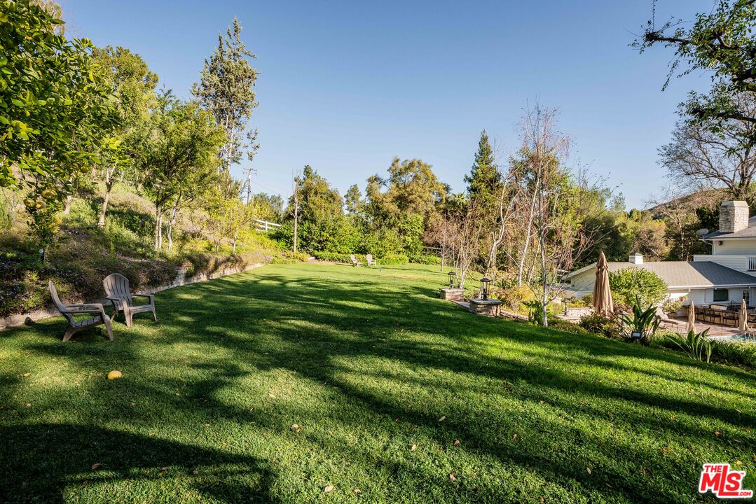 23939 Long Valley Road Hidden Hills, CA 91302 - Photo 16 of 61 a view of a golf course with a garden