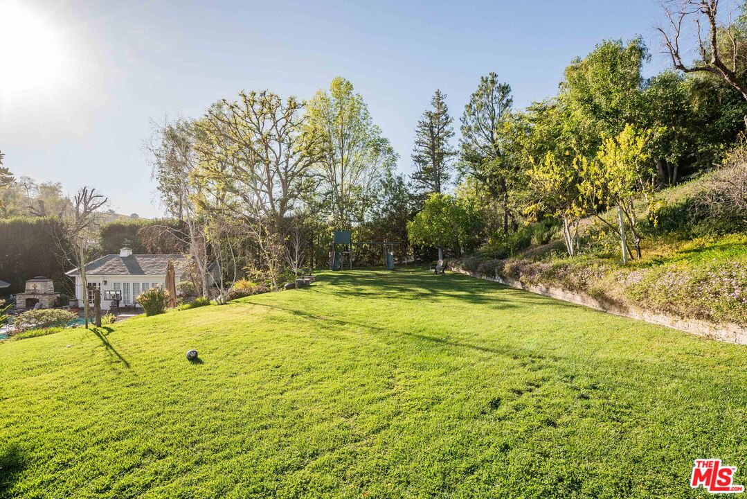 23939 Long Valley Road Hidden Hills, CA 91302 - Photo 18 of 61 a view of swimming pool with an outdoor space