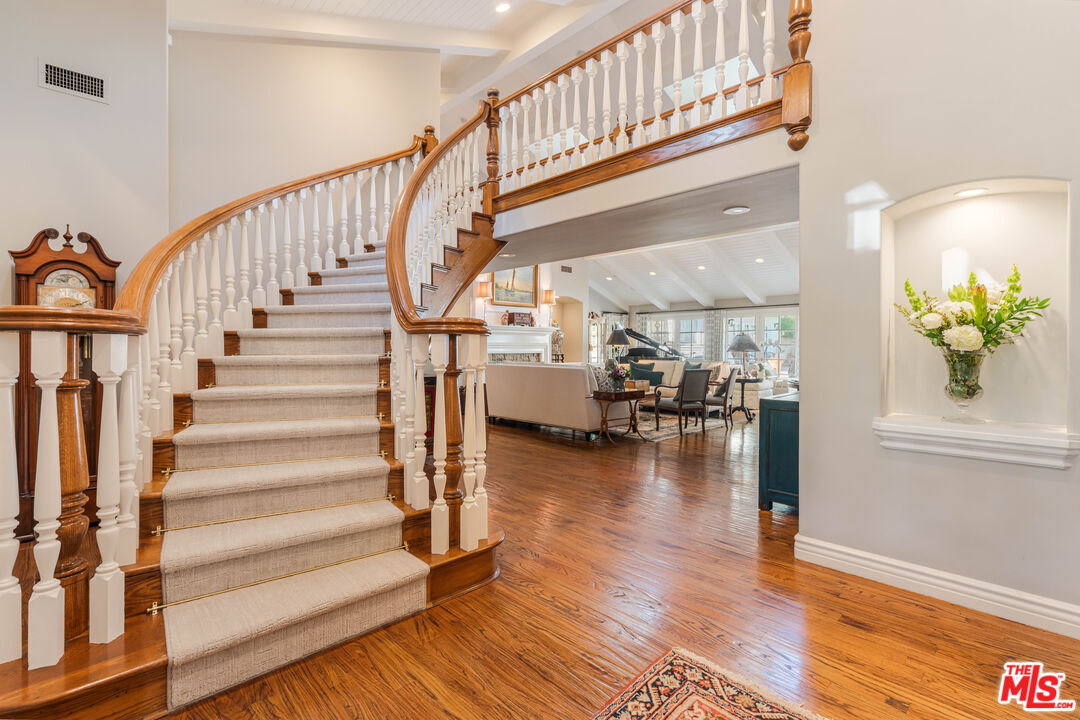 23939 Long Valley Road Hidden Hills, CA 91302 - Photo 20 of 61 a view of entryway and hall with wooden floor