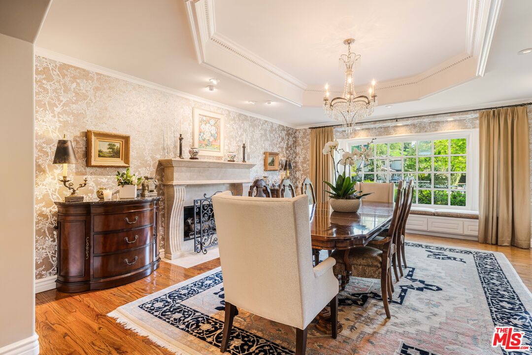 23939 Long Valley Road Hidden Hills, CA 91302 - Photo 22 of 61 a view of a dining room with furniture window and wooden floor