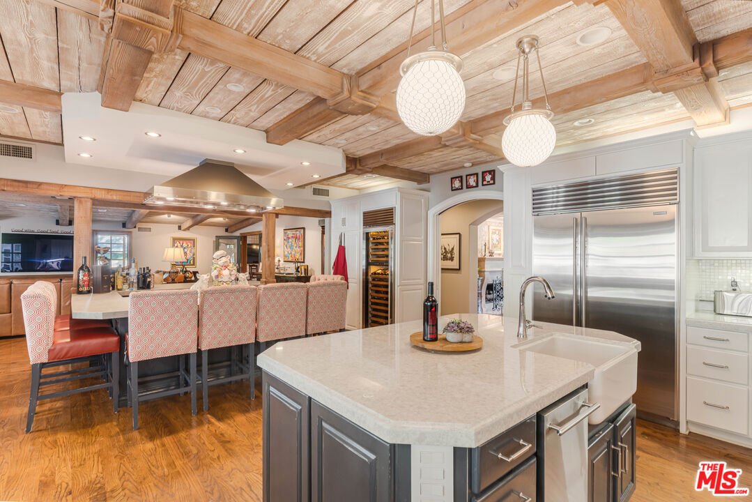 23939 Long Valley Road Hidden Hills, CA 91302 - Photo 28 of 61 a kitchen with a table and chairs in it