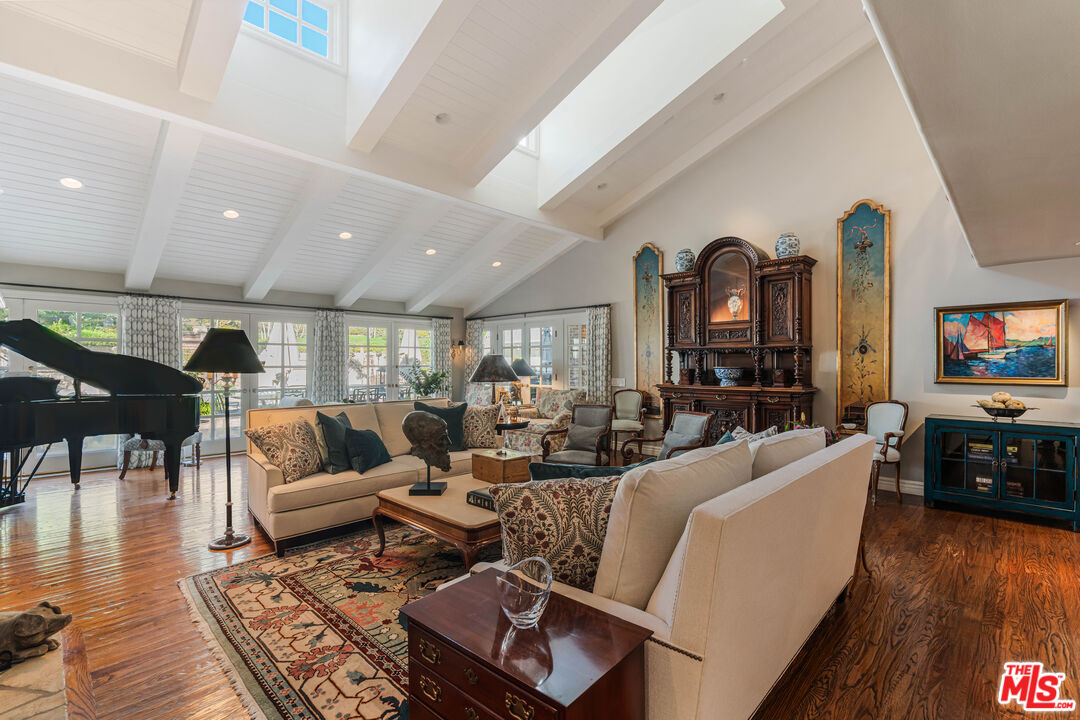 23939 Long Valley Road Hidden Hills, CA 91302 - Photo 35 of 61 a living room with furniture and a flat screen tv