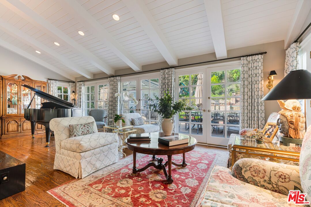 23939 Long Valley Road Hidden Hills, CA 91302 - Photo 37 of 61 a living room with furniture and a large window
