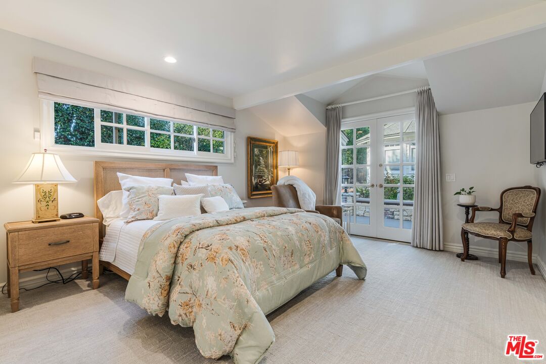 23939 Long Valley Road Hidden Hills, CA 91302 - Photo 38 of 61 a bed room with a bed and a chair