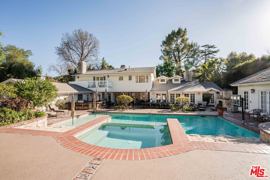 23939 Long Valley Road Hidden Hills, CA 91302 - Photo 4 of 61 an aerial view of a house with swimming pool and yard