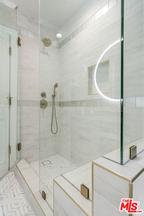 23939 Long Valley Road Hidden Hills, CA 91302 - Photo 44 of 61 a bathroom with a shower and sink