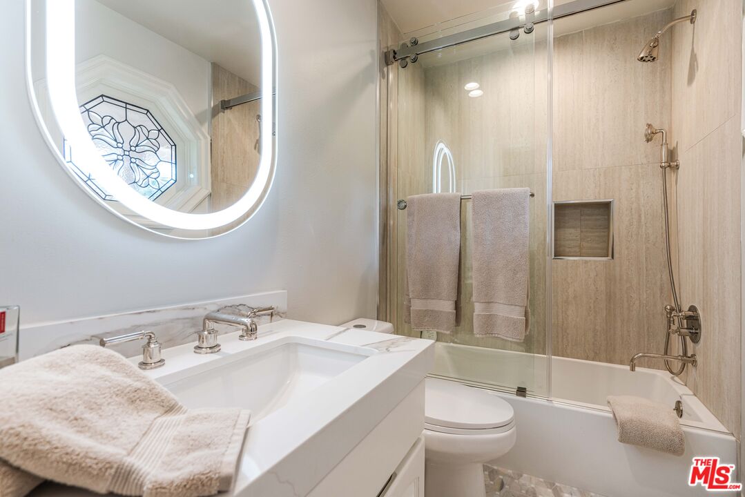 23939 Long Valley Road Hidden Hills, CA 91302 - Photo 46 of 61 a bathroom with a sink toilet and shower
