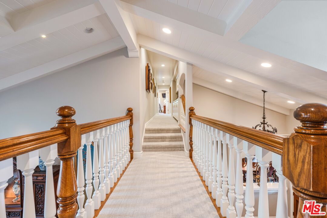 23939 Long Valley Road Hidden Hills, CA 91302 - Photo 47 of 61 a view of a hallway with wooden floor and stairs