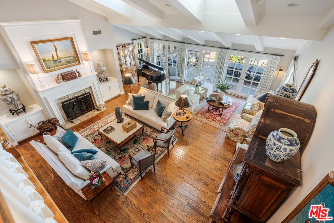 23939 Long Valley Road Hidden Hills, CA 91302 - Photo 48 of 61 a living room with furniture fireplace and flat screen tv