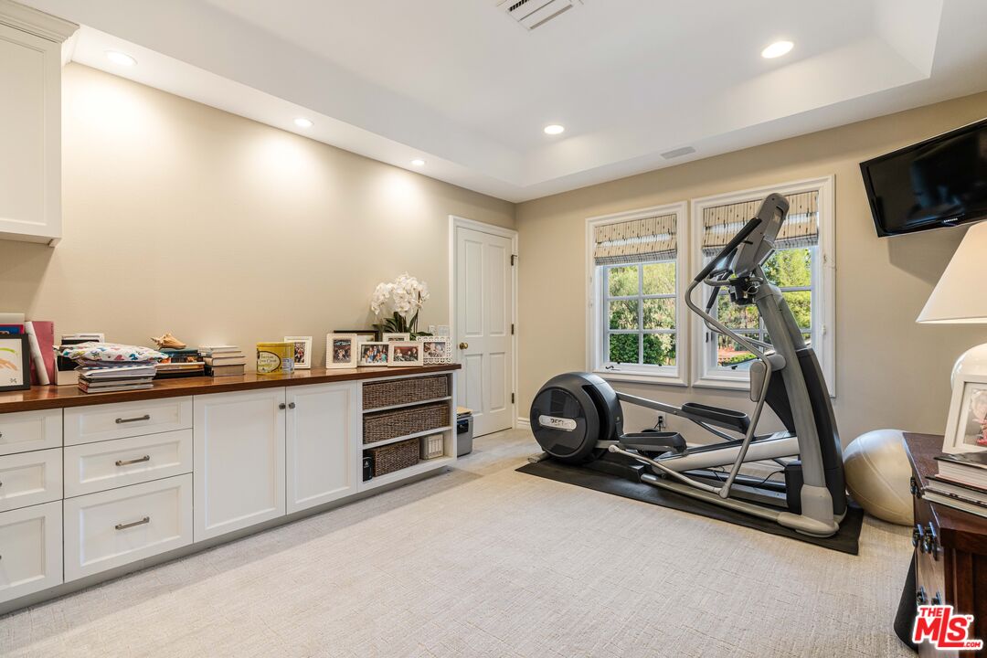 23939 Long Valley Road Hidden Hills, CA 91302 - Photo 49 of 61 a very nice looking room with gym equipment