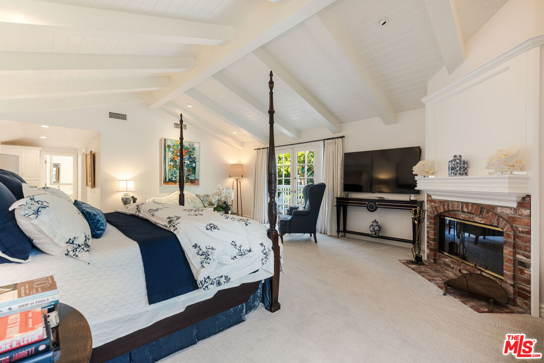 23939 Long Valley Road Hidden Hills, CA 91302 - Photo 50 of 61 a view of bedroom with furniture and flat screen tv