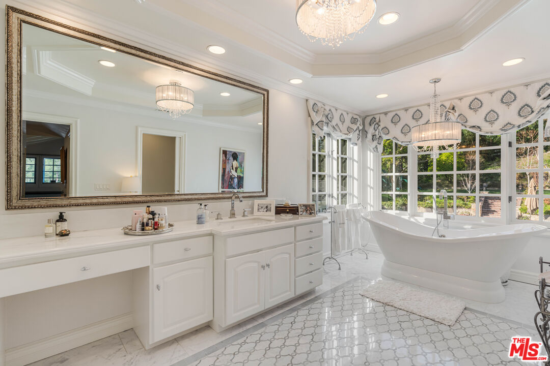 23939 Long Valley Road Hidden Hills, CA 91302 - Photo 53 of 61 a bathroom with a double vanity sink mirror and double