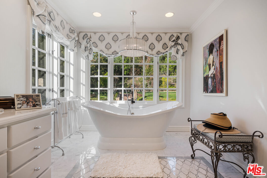 23939 Long Valley Road Hidden Hills, CA 91302 - Photo 54 of 61 a spacious bathroom with a bathtub and next to a window
