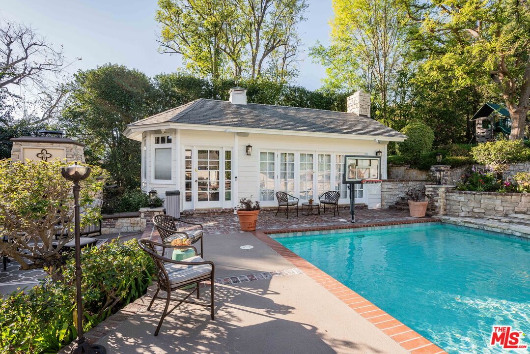 23939 Long Valley Road Hidden Hills, CA 91302 - Photo 6 of 61 a view of a house with swimming pool and sitting area