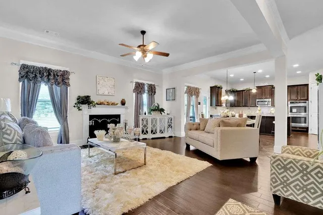 a living room with furniture and a fireplace