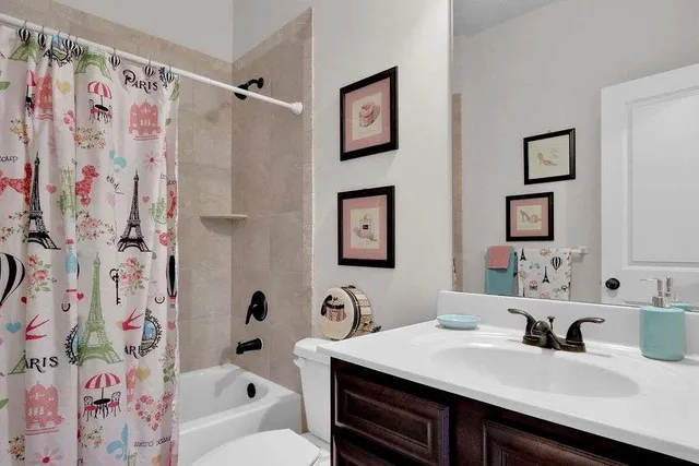 a bath room with a sink and a mirror