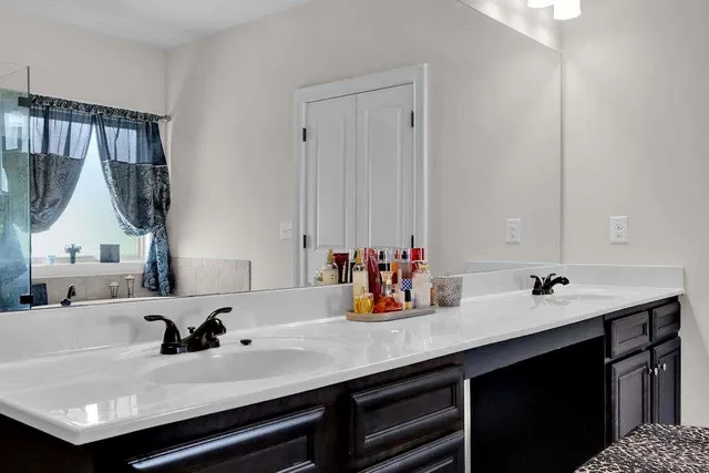 a bathroom with a sink and a mirror