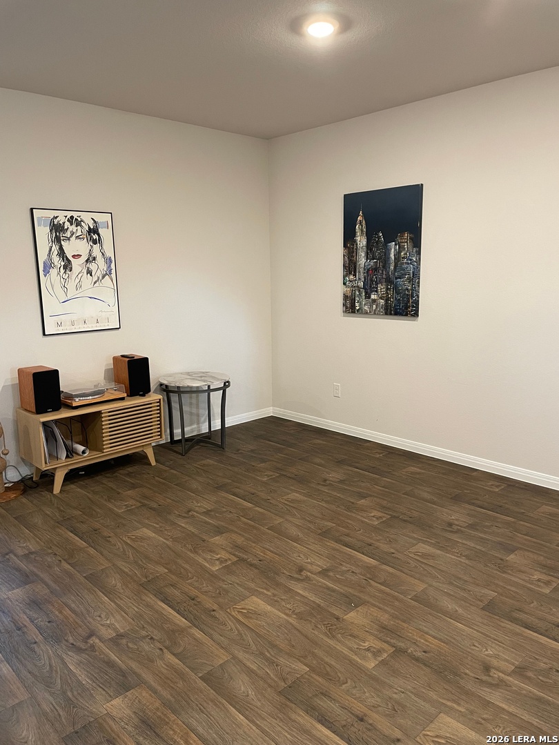 226 Evergreen Sumac Loop Kyle, TX 78640 - Photo 12 of 37 a view of room with wooden floor and lounge chair