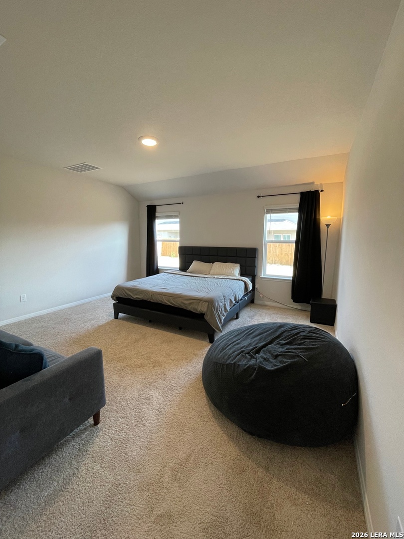 226 Evergreen Sumac Loop Kyle, TX 78640 - Photo 17 of 37 a bedroom with two beds and painting on the wall