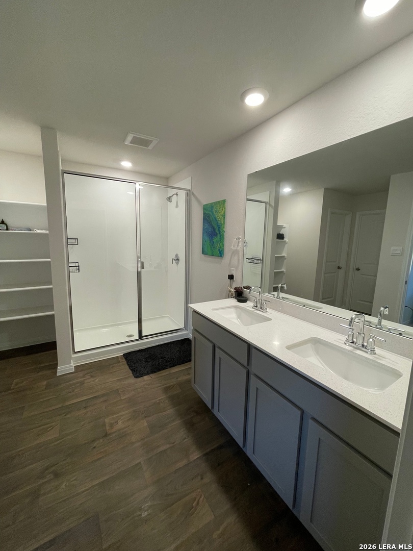 226 Evergreen Sumac Loop Kyle, TX 78640 - Photo 18 of 37 a bathroom with a double vanity sink and a mirror