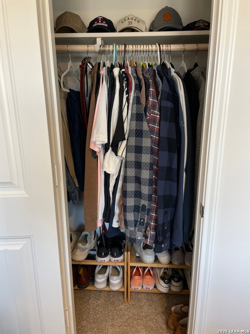 226 Evergreen Sumac Loop Kyle, TX 78640 - Photo 25 of 37 a view of walk in closet with clothes and shoes