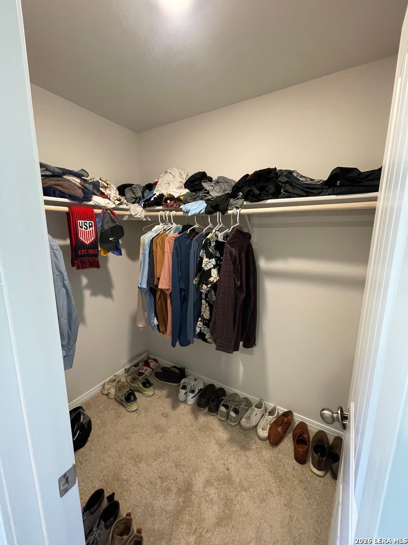 226 Evergreen Sumac Loop Kyle, TX 78640 - Photo 29 of 37 a view of walk in closet with clothes and shoes