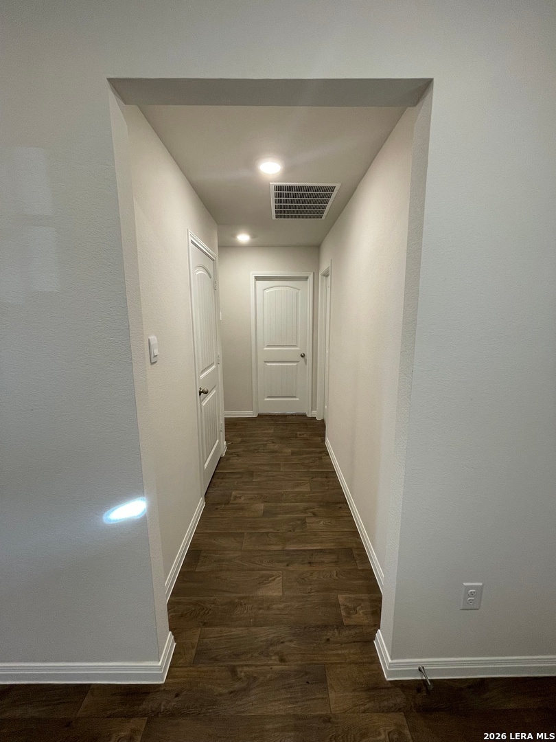 226 Evergreen Sumac Loop Kyle, TX 78640 - Photo 32 of 37 a view of hallway with wooden floor