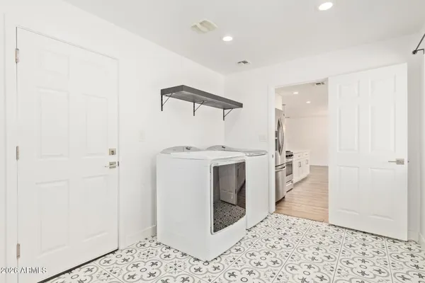 a view of a hallway with washer and dryer