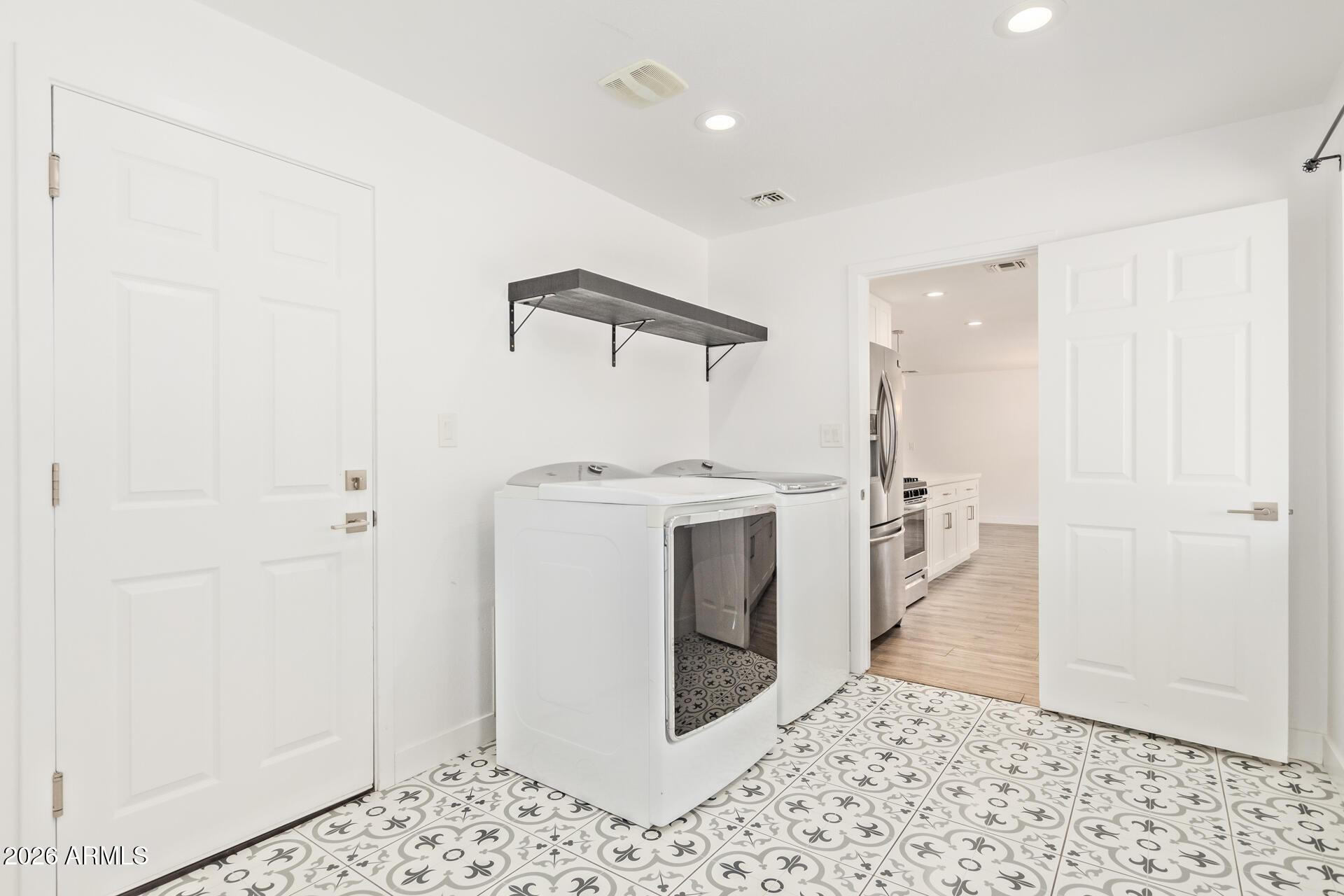 1809 East Concorda Drive Tempe, AZ 85282 - Photo 19 of 23 a view of a hallway with washer and dryer