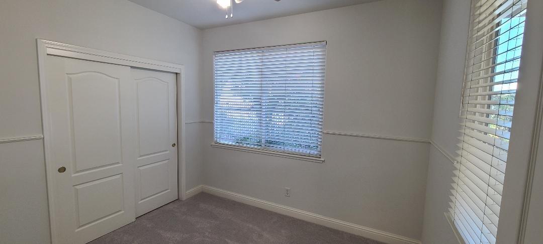 1611 North Monaco Lane Clovis, CA 93619 - Photo 7 of 16 a view of an empty room with a window
