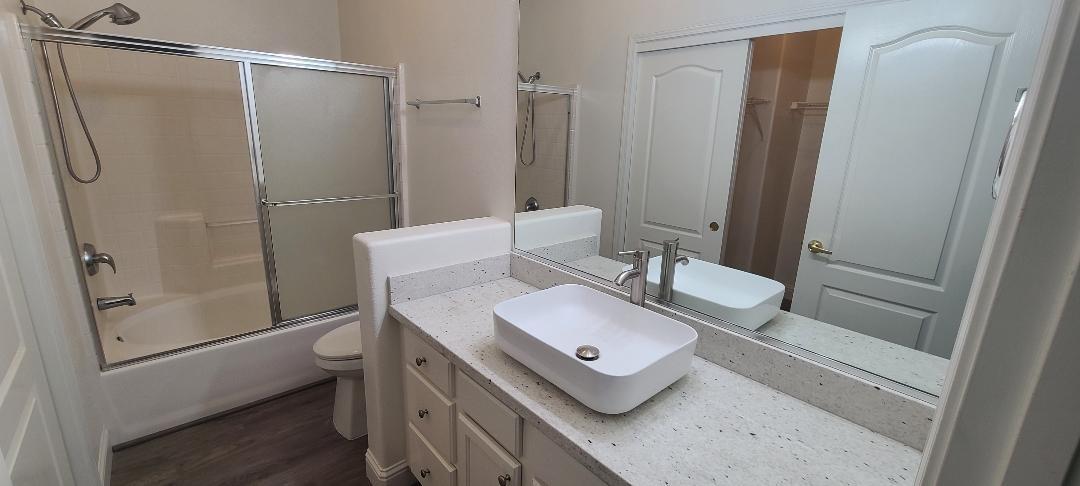 1611 North Monaco Lane Clovis, CA 93619 - Photo 8 of 16 a bathroom with a sink toilet and shower