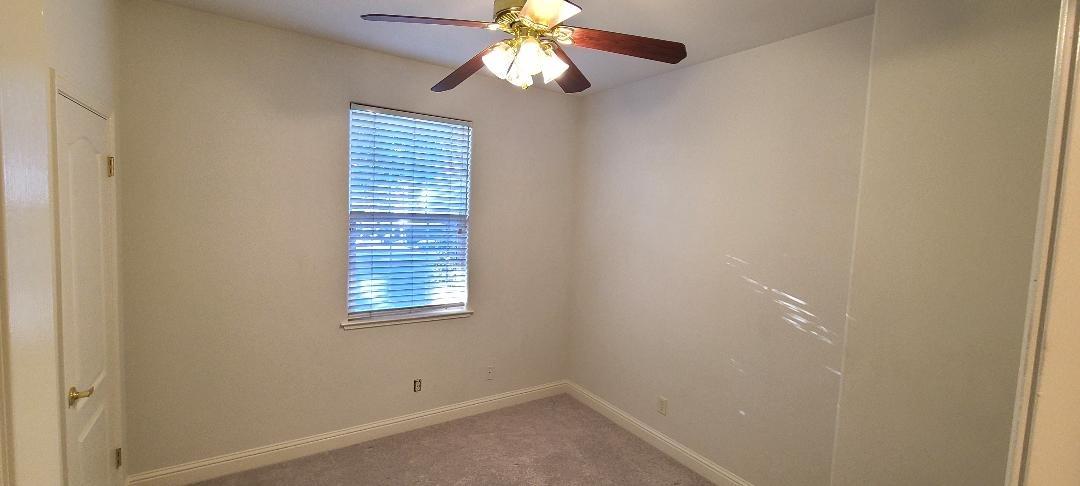 1611 North Monaco Lane Clovis, CA 93619 - Photo 9 of 16 a view of an empty room with a window
