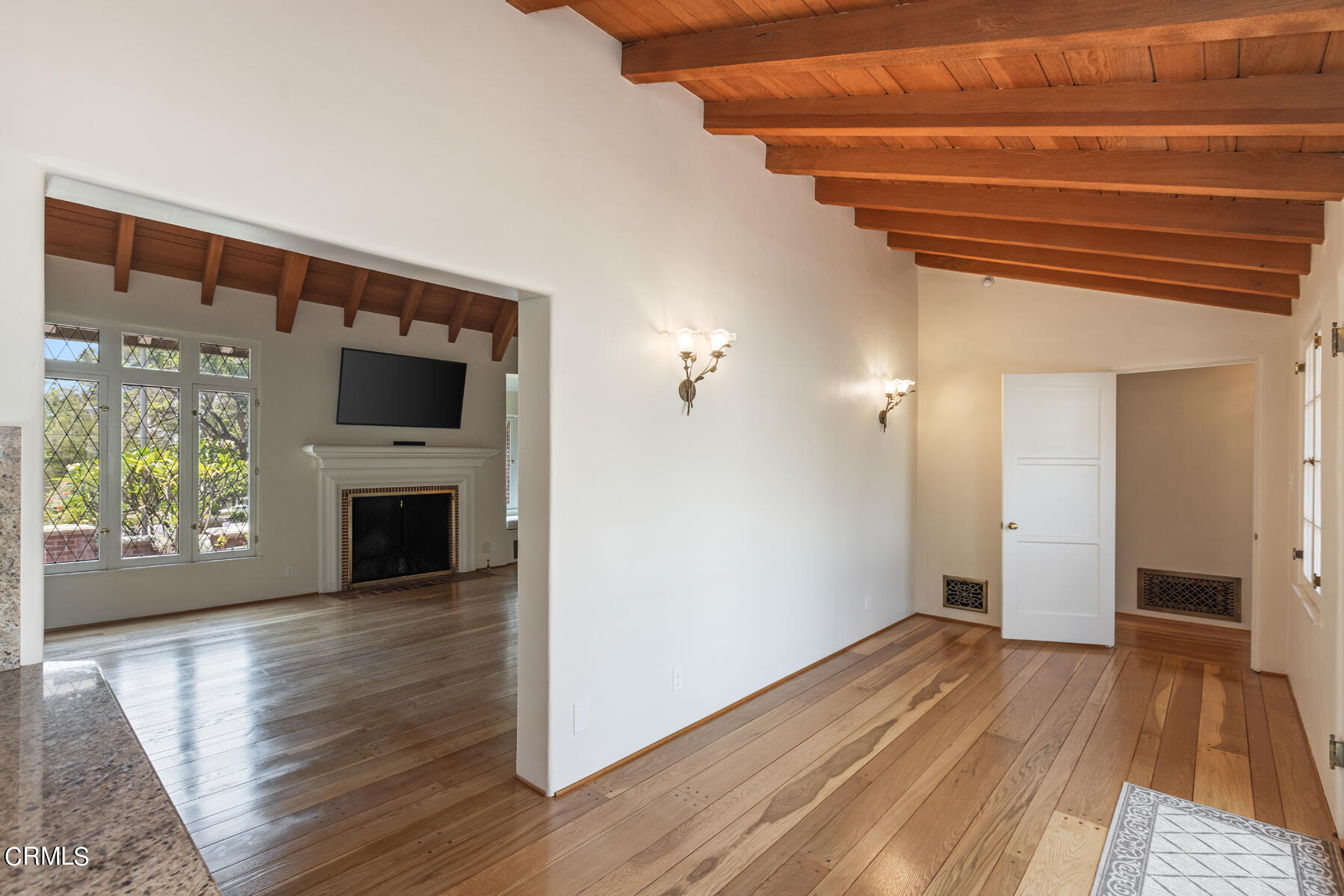 369 West Kenneth Road Glendale, CA 91202 - Photo 16 of 45 a view of empty room with wooden floor and fireplace