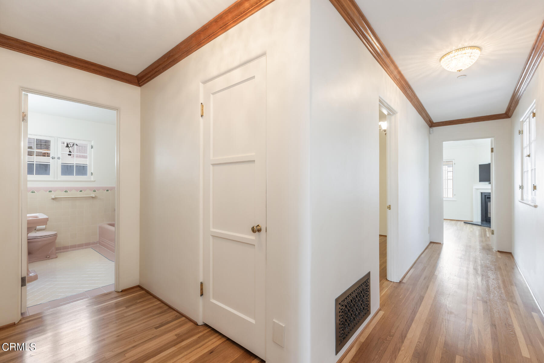 369 West Kenneth Road Glendale, CA 91202 - Photo 28 of 45 a view of a hallway with wooden floor and a bathroom