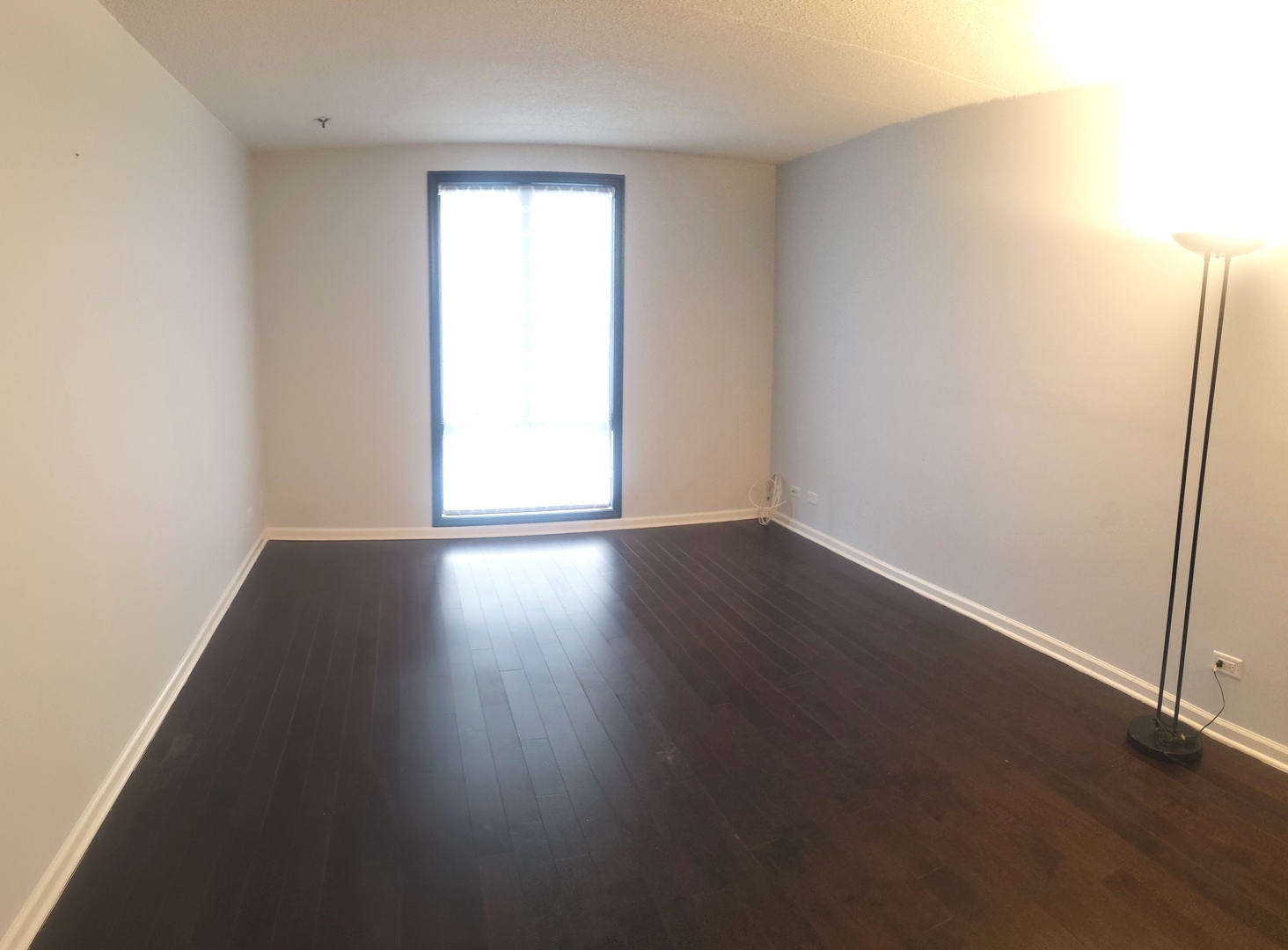 8350 West Addison Street, Unit 201 Chicago, IL 60634 - Photo 13 of 41 an empty room with wooden floor and windows