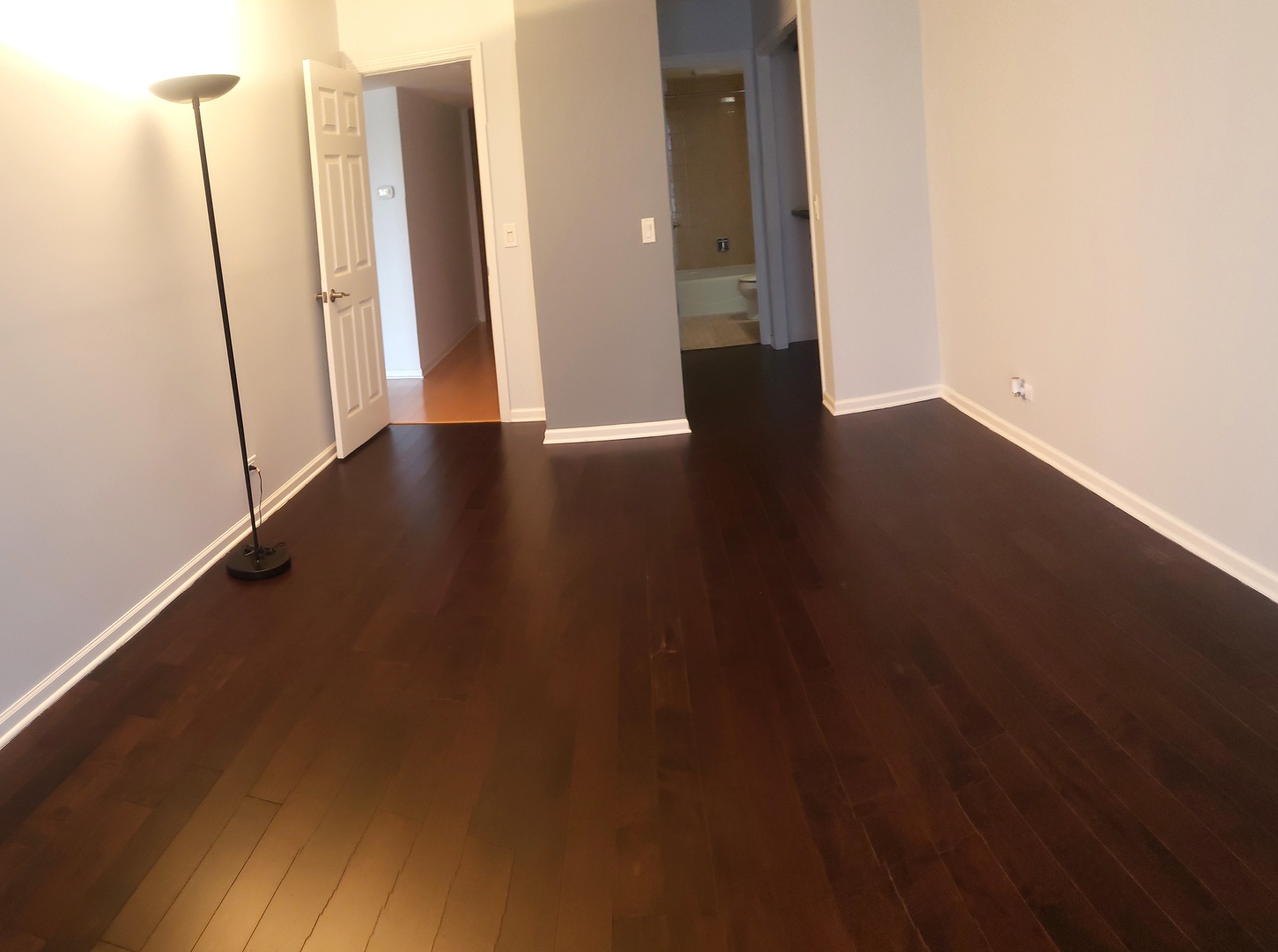 8350 West Addison Street, Unit 201 Chicago, IL 60634 - Photo 14 of 41 an empty room with wooden floor and entrance
