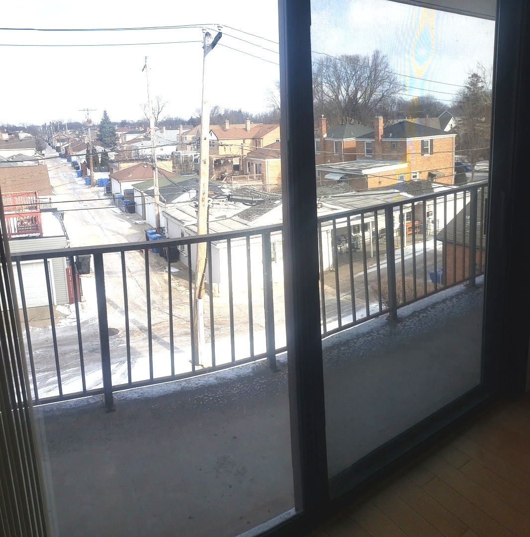 8350 West Addison Street, Unit 201 Chicago, IL 60634 - Photo 23 of 41 a view of a city from a window