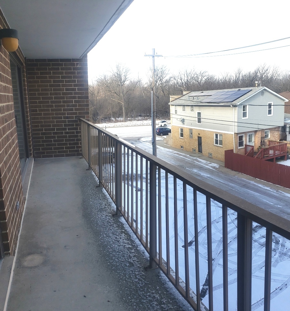 8350 West Addison Street, Unit 201 Chicago, IL 60634 - Photo 24 of 41 a view of a balcony with furniture