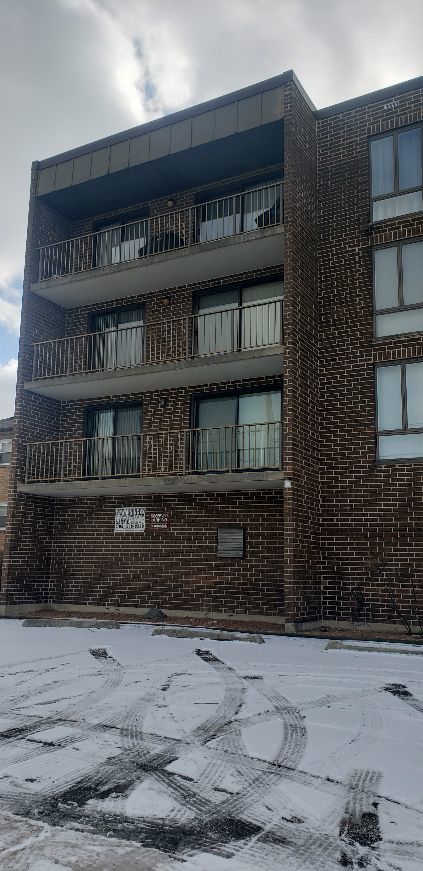8350 West Addison Street, Unit 201 Chicago, IL 60634 - Photo 27 of 41 a front view of a building