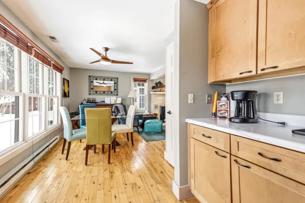 a view of a dining room with furniture window and wooden floor