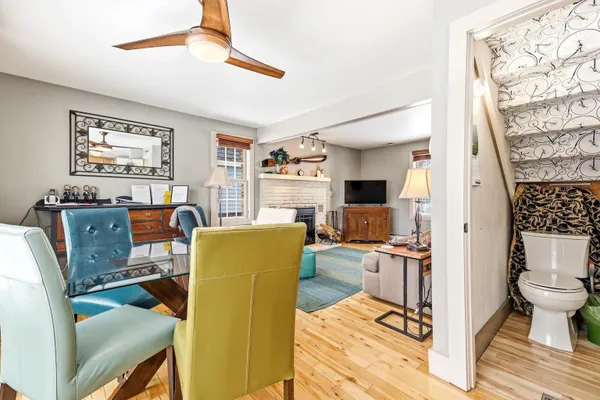 a view of a livingroom with workspace and a window