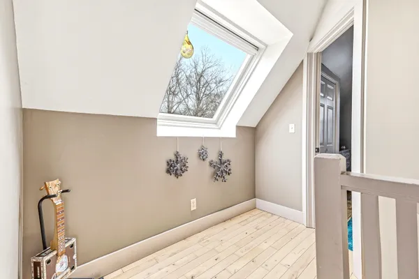 a view of room with window and hallway