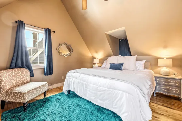 a bedroom with a bed and window