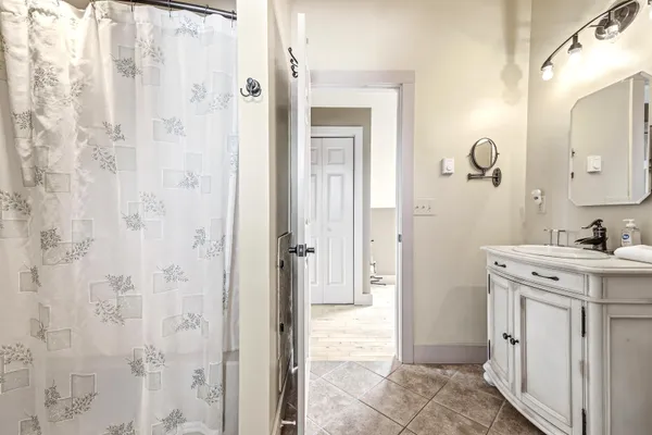a bathroom with a sink and a mirror