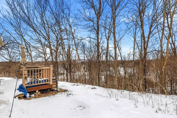 a wooden bench sitting in front of a house